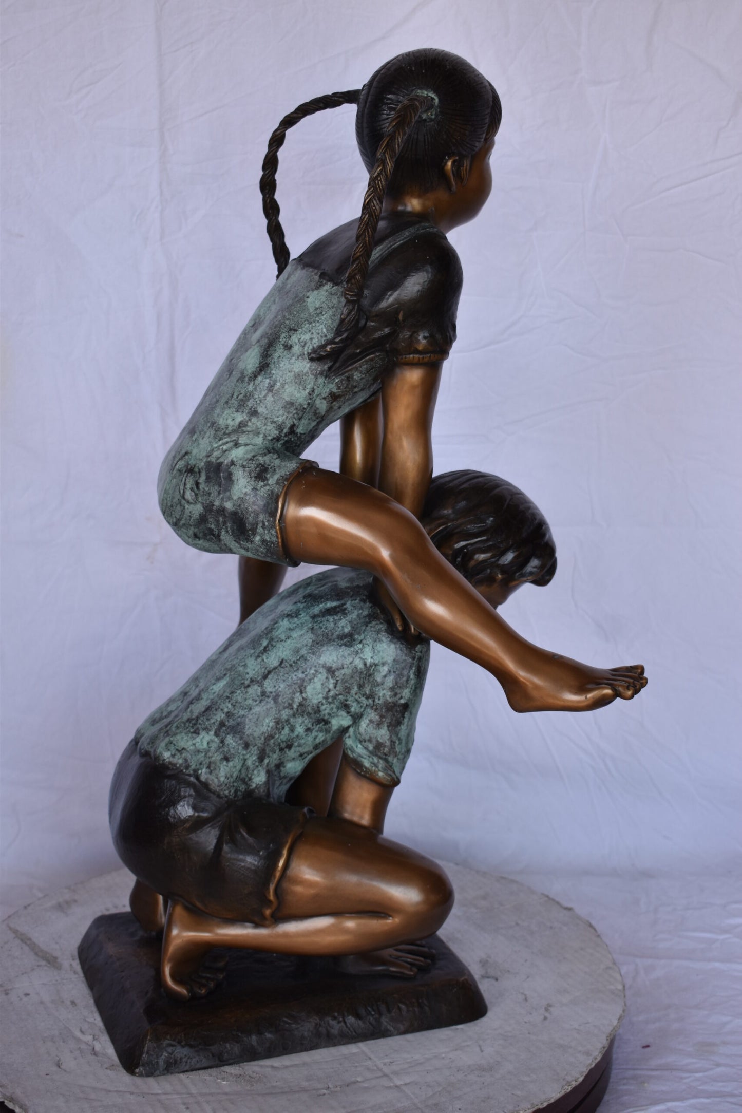 Boy and Girl Leapfrog Jumping Bronze Statue - Size: 25"L x 20"W x 32"H.