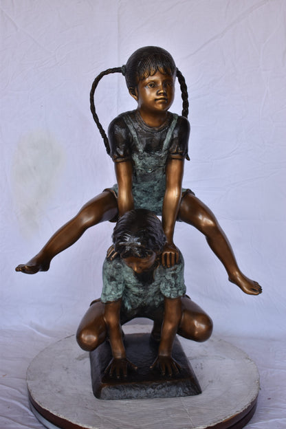 Boy and Girl Leapfrog Jumping Bronze Statue - Size: 25"L x 20"W x 32"H.
