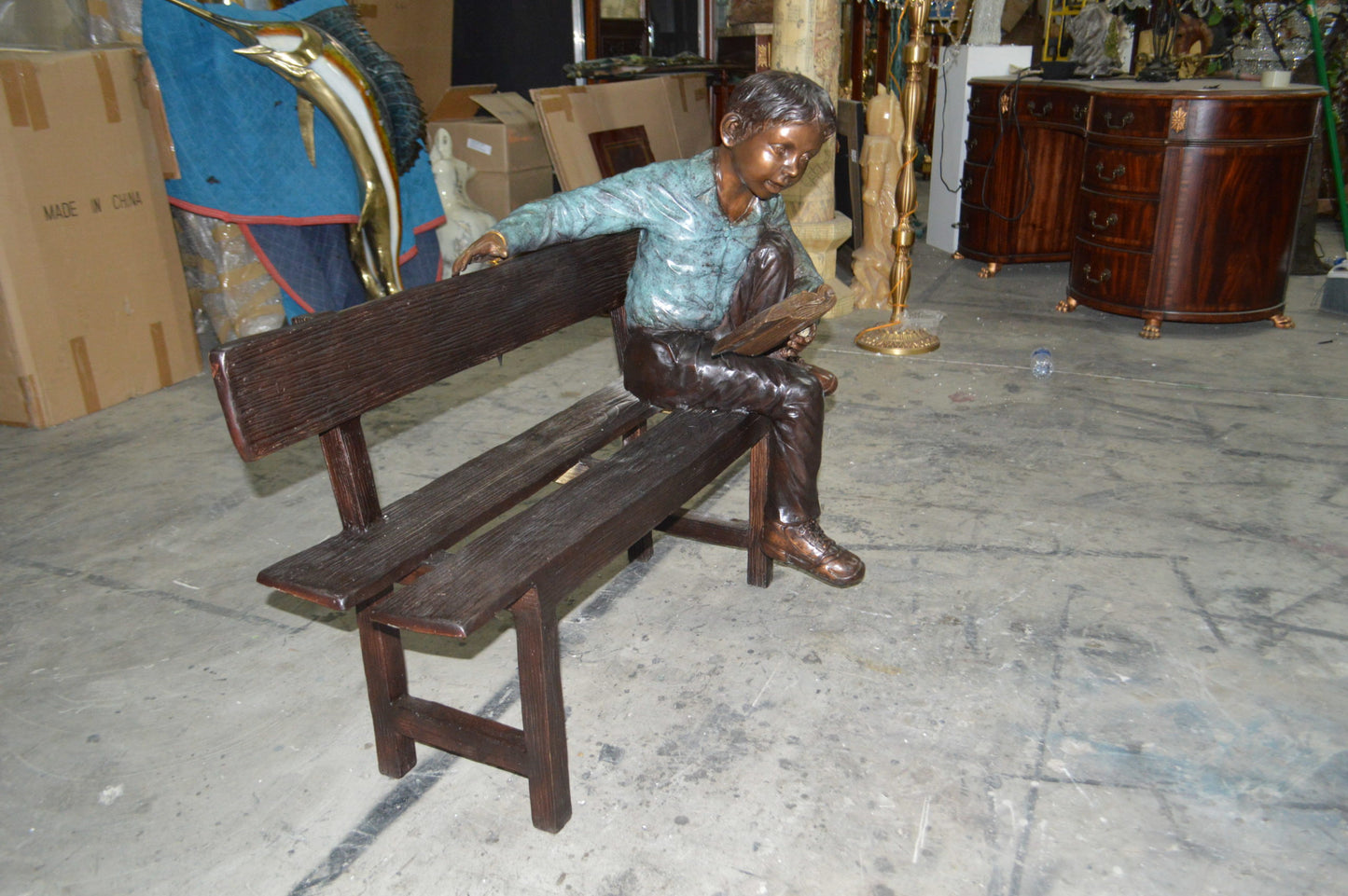 boy Sitting on a Bench reading book bronze Statue -  Size: 43"L x 20"W x 36"H.