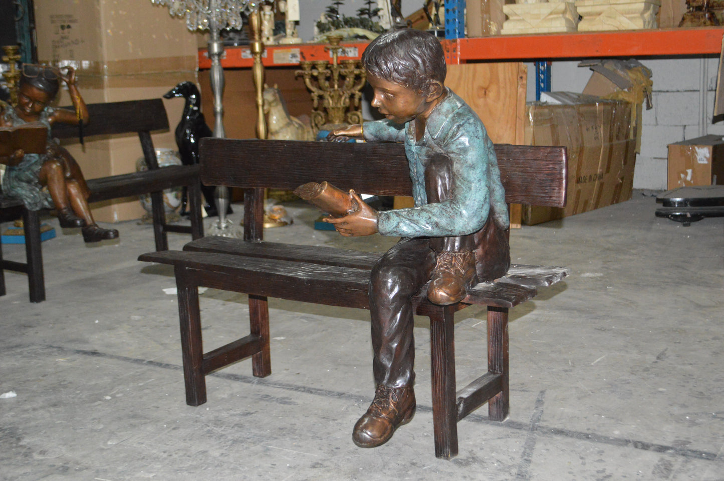 boy Sitting on a Bench reading book bronze Statue -  Size: 43"L x 20"W x 36"H.