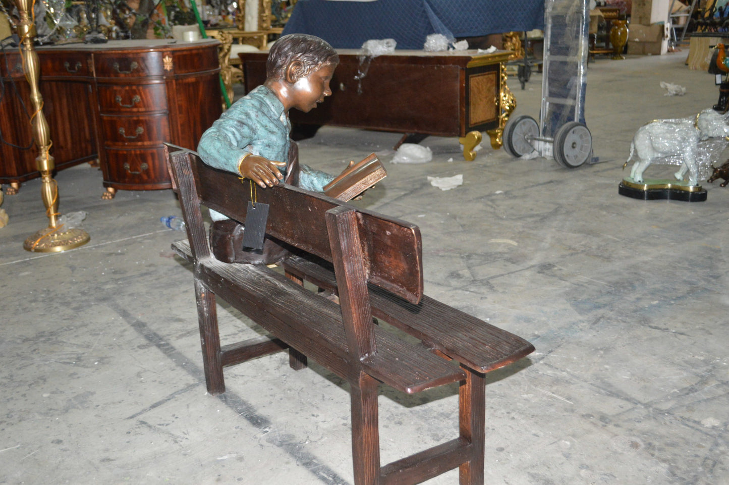 boy Sitting on a Bench reading book bronze Statue -  Size: 43"L x 20"W x 36"H.