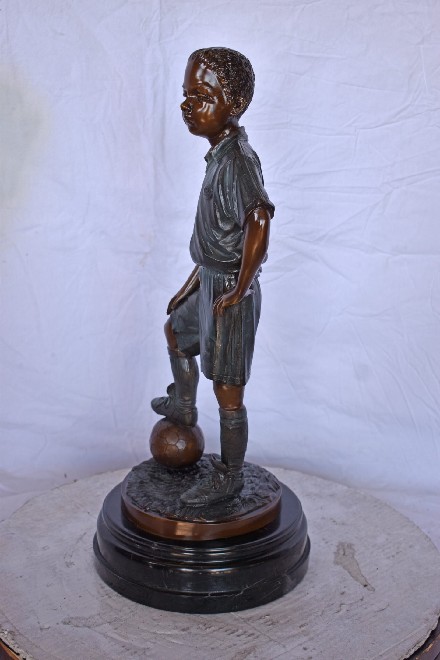 Soccer Boy Player in Action Bronze Statue on Marble - Size: 12"L x 12"W x 26"H.