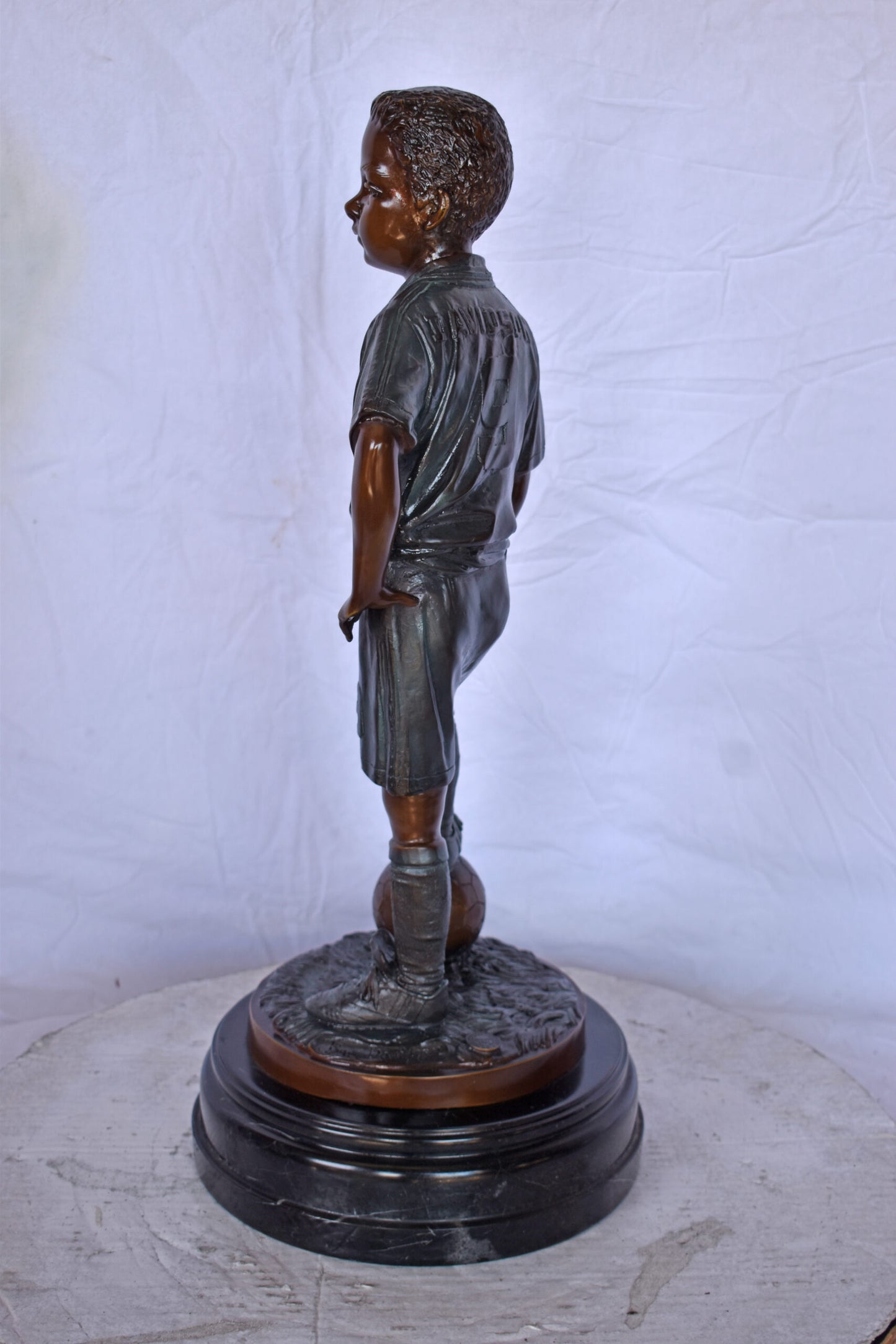 Soccer Boy Player in Action Bronze Statue on Marble - Size: 12"L x 12"W x 26"H.