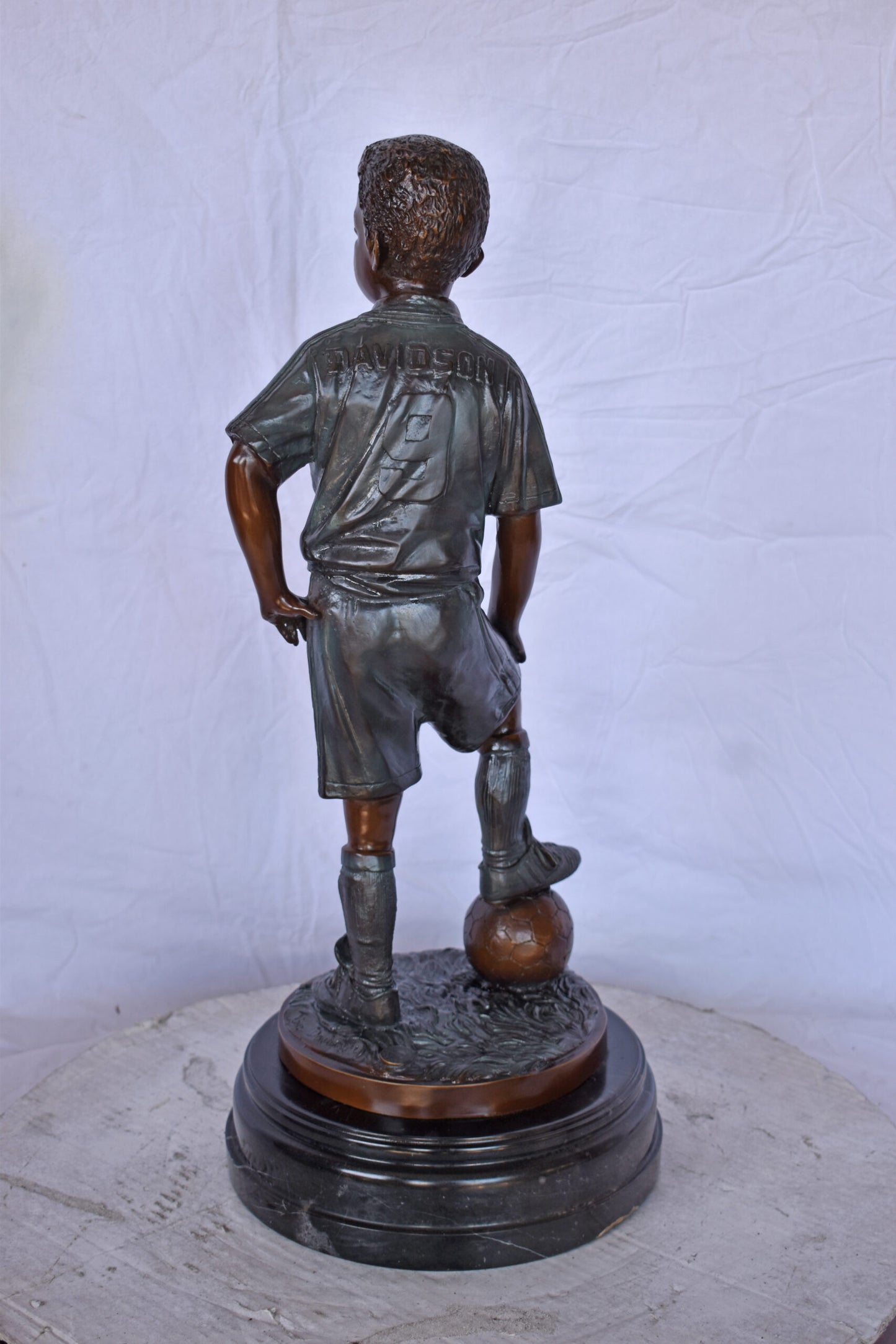 Soccer Boy Player in Action Bronze Statue on Marble - Size: 12"L x 12"W x 26"H.