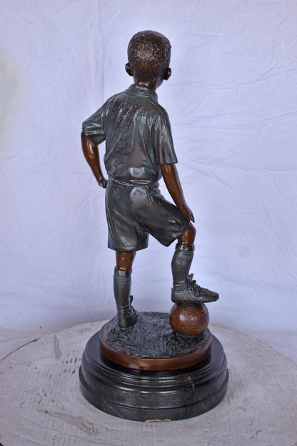 Soccer Boy Player in Action Bronze Statue on Marble - Size: 12"L x 12"W x 26"H.