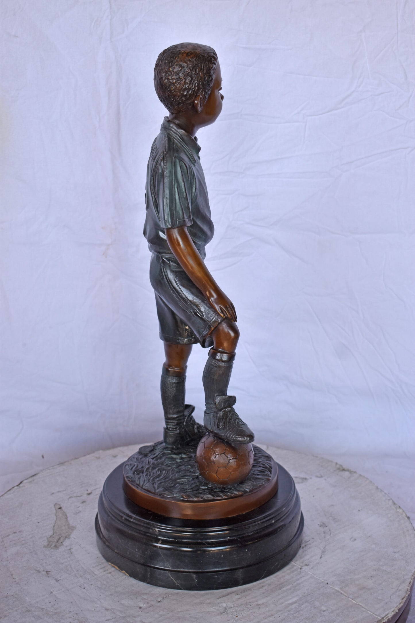 Soccer Boy Player in Action Bronze Statue on Marble - Size: 12"L x 12"W x 26"H.