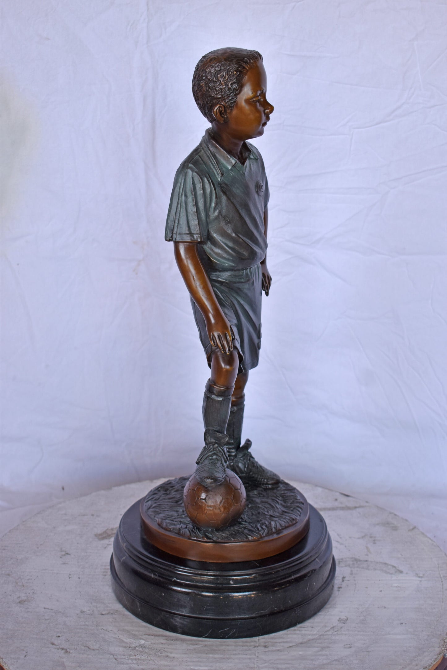 Soccer Boy Player in Action Bronze Statue on Marble - Size: 12"L x 12"W x 26"H.