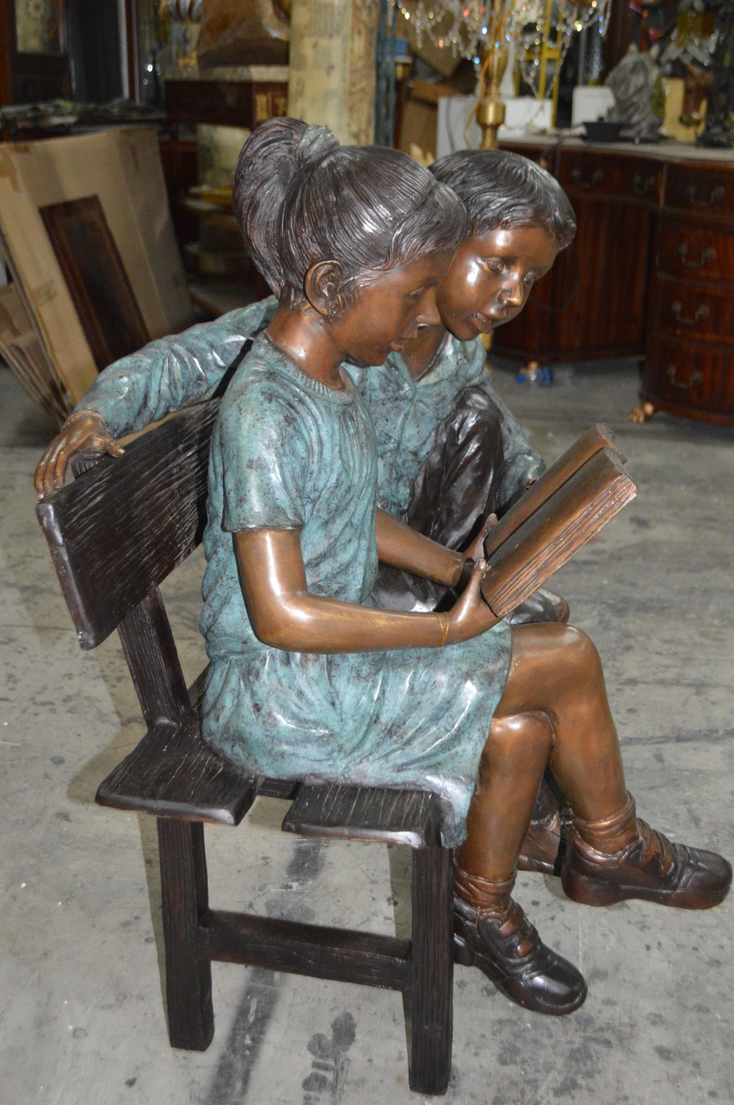Boy and a Girl on Bench reading book bronze Statue -  Size: 43"L x 20"W x 36"H.