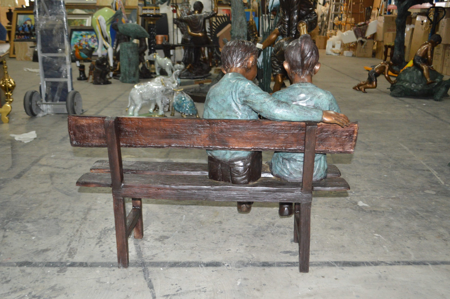 Boy and a Girl on Bench reading book bronze Statue -  Size: 43"L x 20"W x 36"H.