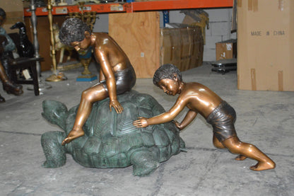 Two Kids on a Giant Turtle Bronze Fountain -  Size: 23"L x 60"W x 33"H.