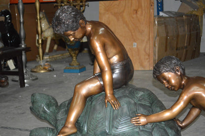 Two Kids on a Giant Turtle Bronze Fountain -  Size: 23"L x 60"W x 33"H.