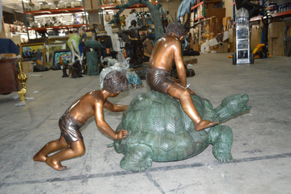 Two Kids on a Giant Turtle Bronze Fountain -  Size: 23"L x 60"W x 33"H.