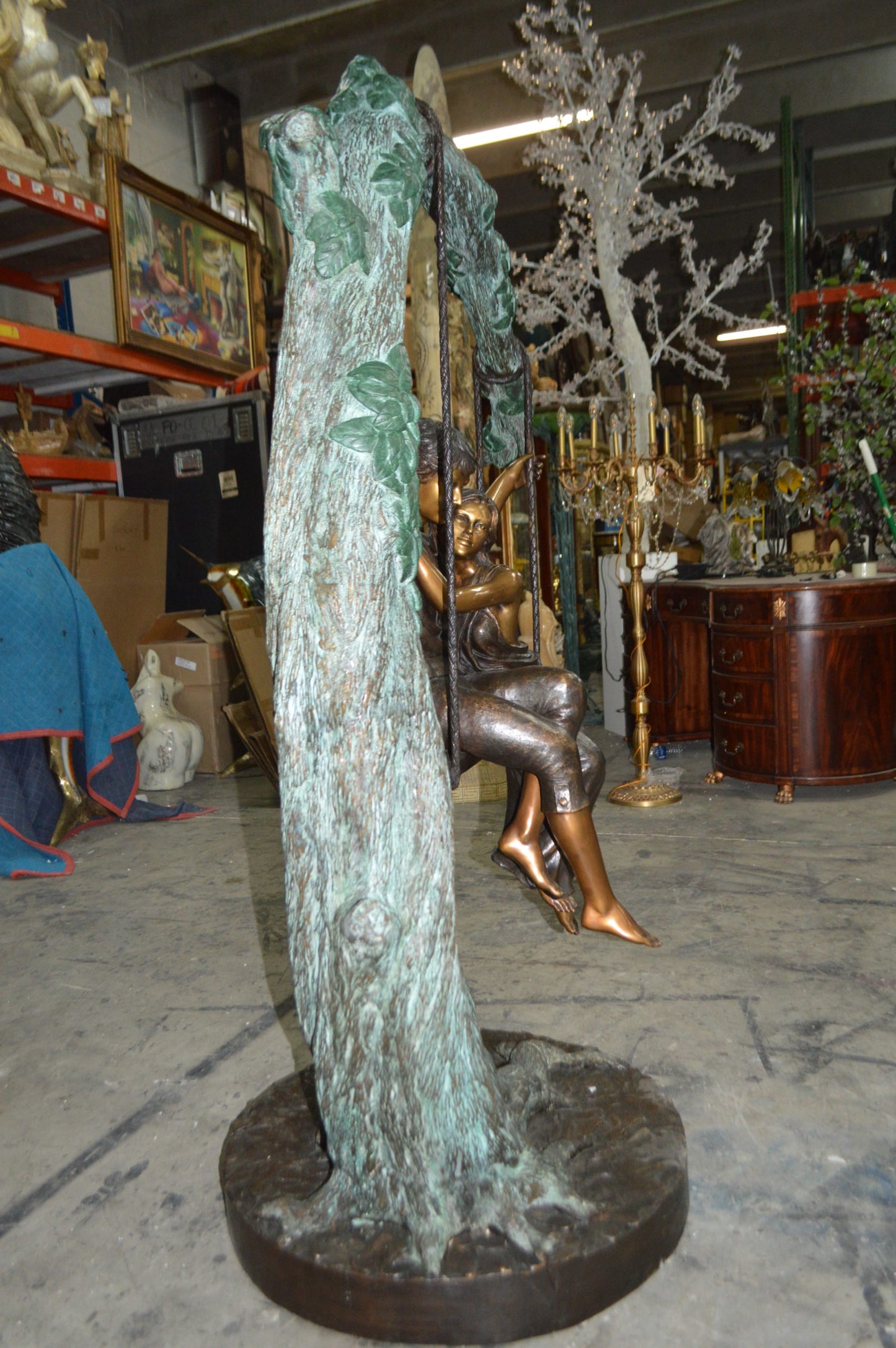 Lovers on a Swing Bronze Statue -  Size: 48"L x 32"W x 64"H.