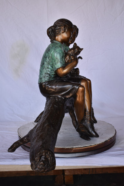 Boy and Girl with Pets Sitting on Log Bronze Statue - Size: 44"L x 22"W x 26"H.