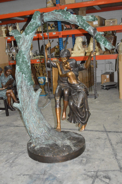 Lovers on a Swing Bronze Statue -  Size: 48"L x 32"W x 64"H.