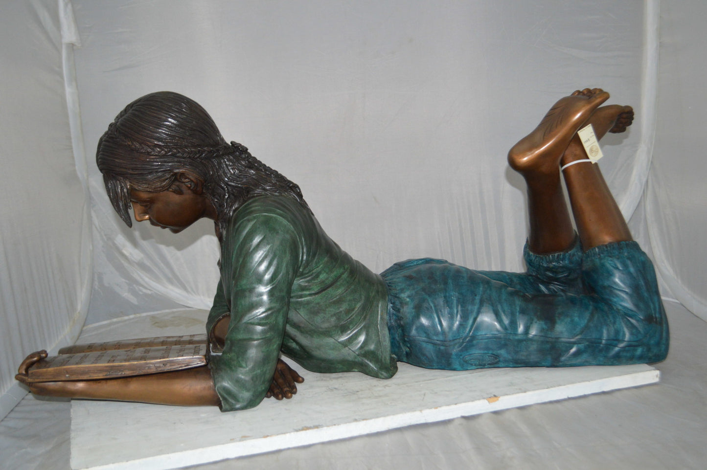 Kate Reading a Book Bronze Statue -  Size: 42"L x 18"W x 17"H.
