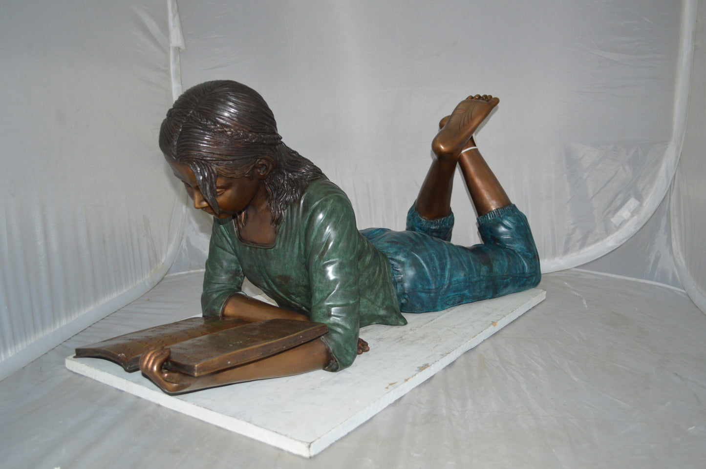 Kate Reading a Book Bronze Statue -  Size: 42"L x 18"W x 17"H.