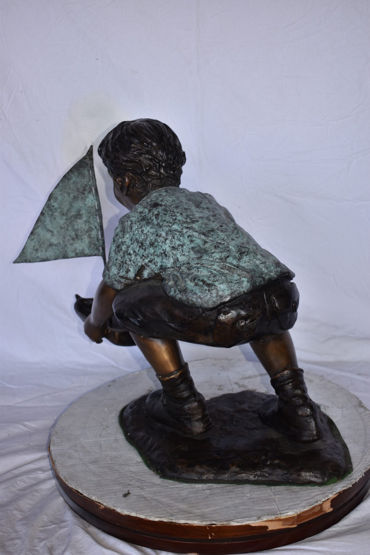 Boy Sends His Toy Boat on The Water Bronze Statue - Size: 16"L x 33"W x 24"H.