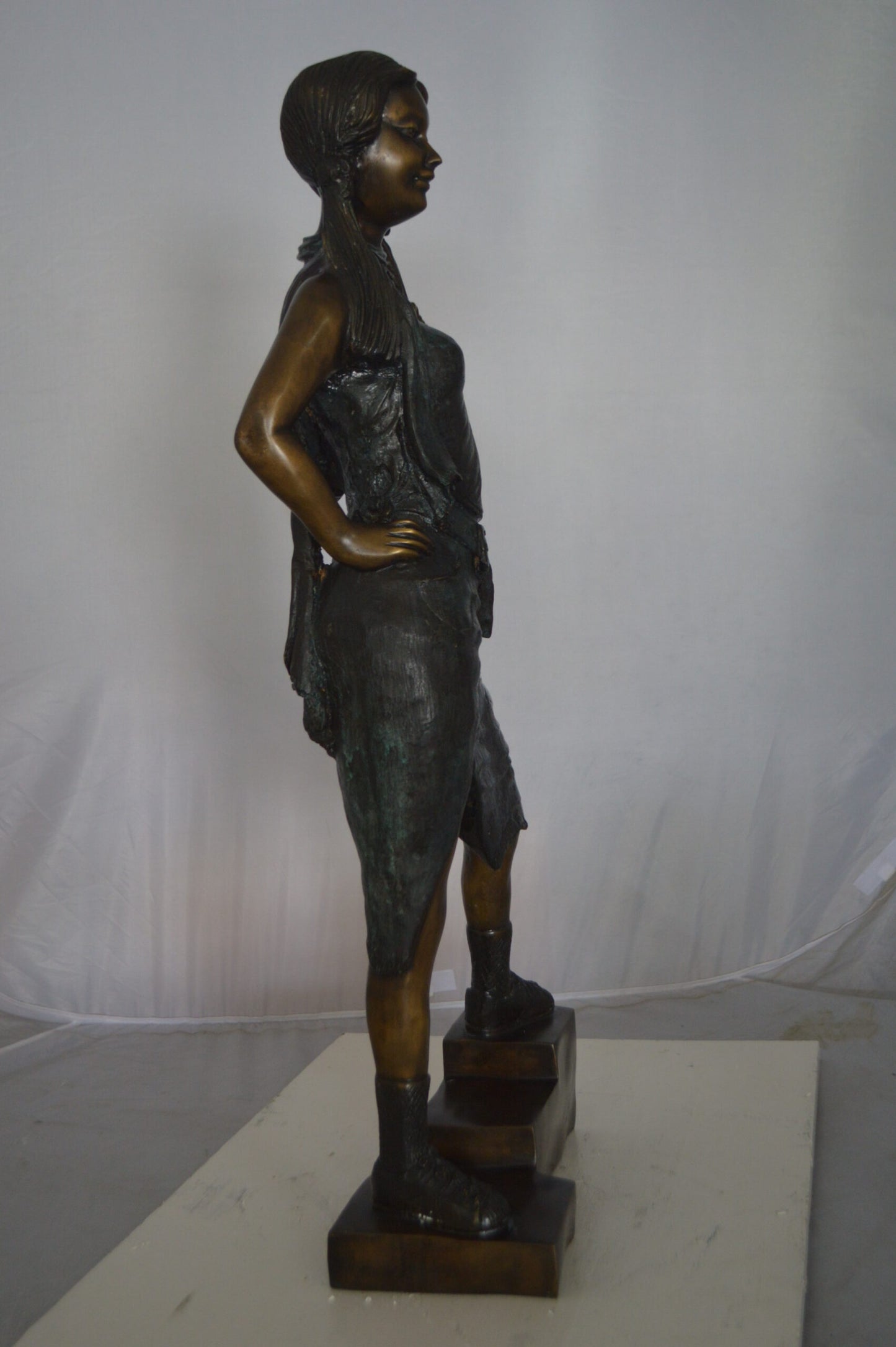 Girl Posing on Steps Bronze Statue -  Size: 7"L x 12"W x 33"H.