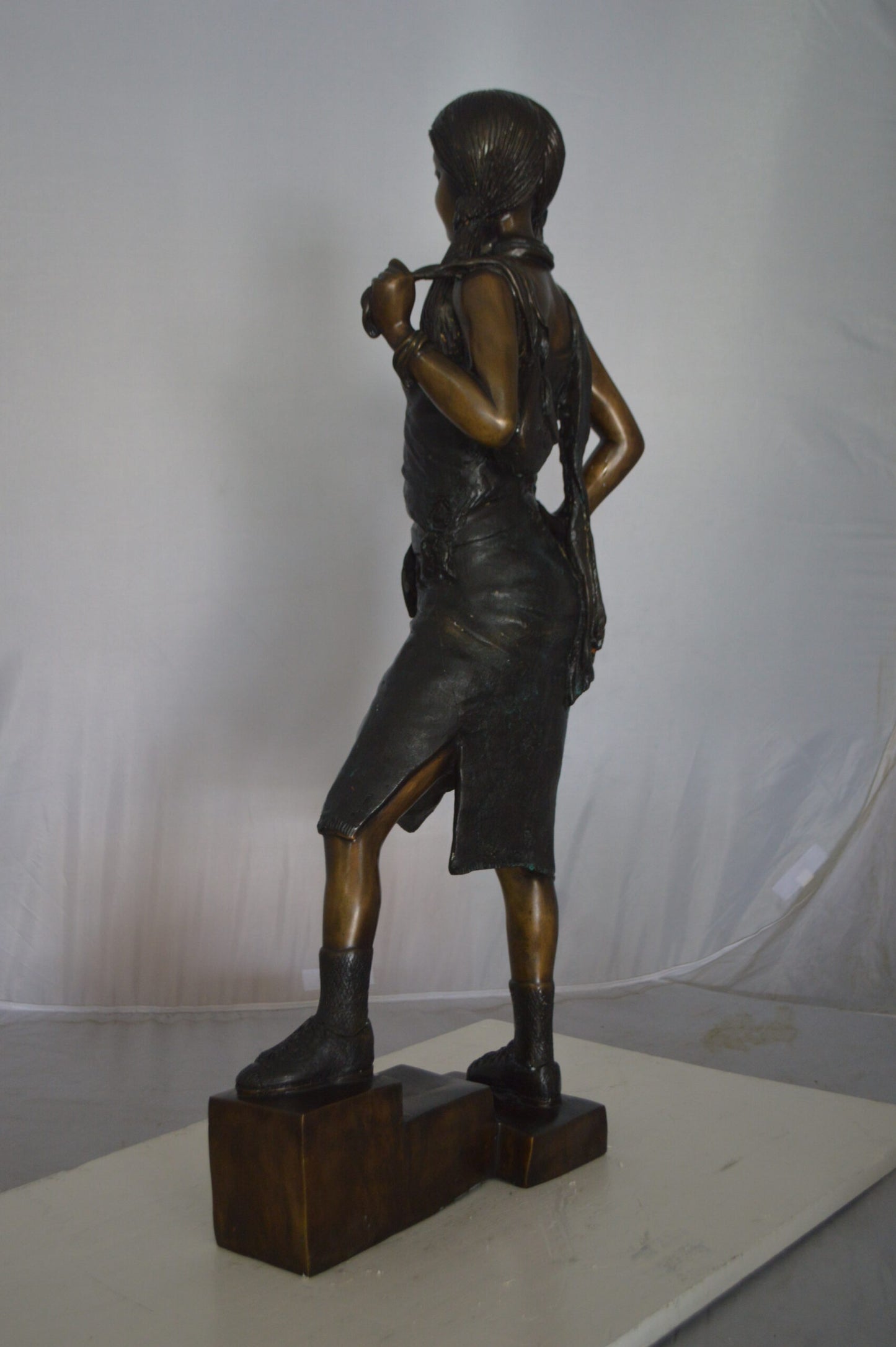 Girl Posing on Steps Bronze Statue -  Size: 7"L x 12"W x 33"H.