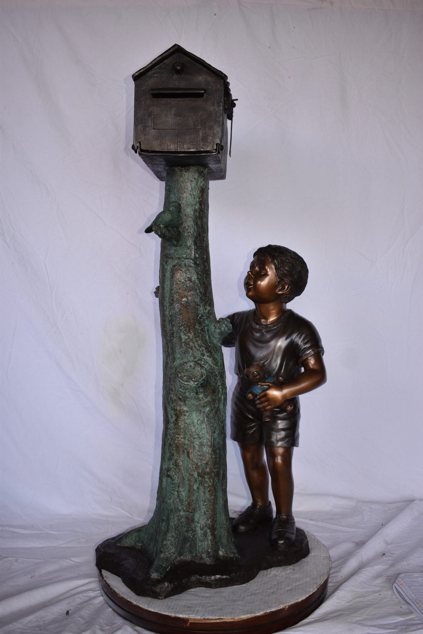 A Boy Standing by His Mailbox Looking at Birds Bronze Statue  25" x 22" x 51"H.