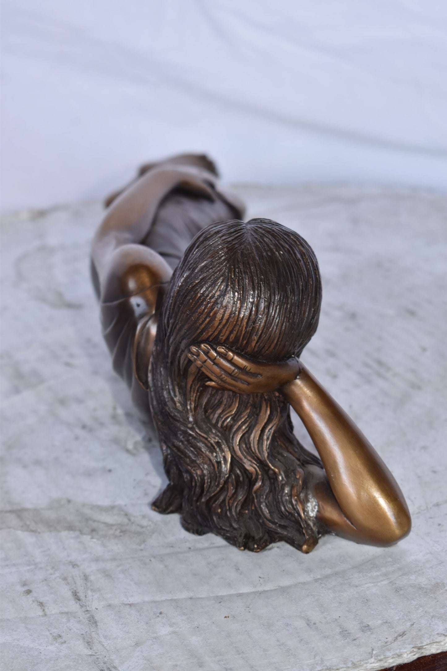 Gorgeous Young Lady Laying on The Ground Bronze Statue - Size: 5"L x 21"W x 5"H.