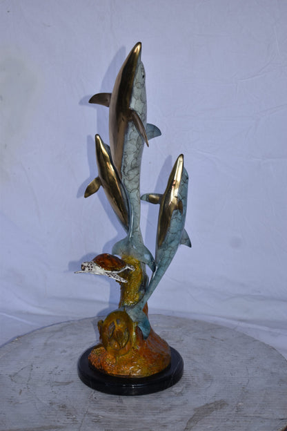 Three Dolphins Jumping Next to A Sea Turtle Bronze Statue  10"x 11" x 24"H.
