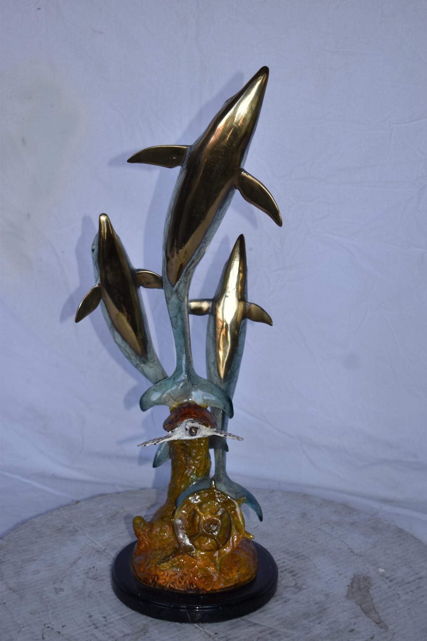 Three Dolphins Jumping Next to A Sea Turtle Bronze Statue  10"x 11" x 24"H.