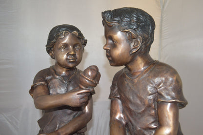 Boy and Girl enjoying an ice-cream bronze statue -  Size: 28"L x 24"W x 33"H.