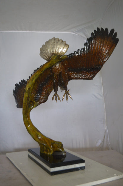 Eagle Soaring Bronze Statue by W Aribu -  Size: 35"L x 27"W x 38"H.