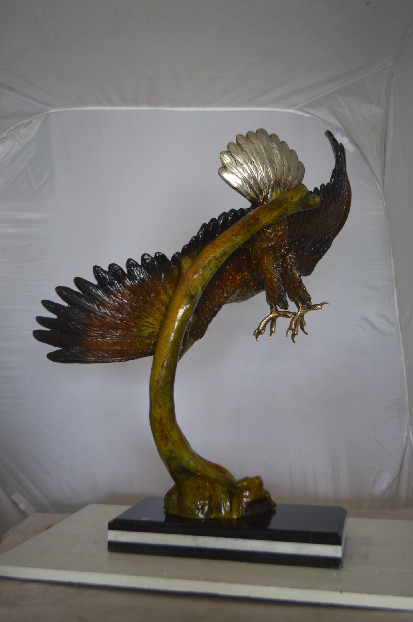 Eagle Soaring Bronze Statue by W Aribu -  Size: 35"L x 27"W x 38"H.