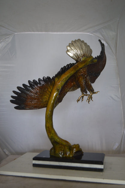 Eagle Soaring Bronze Statue by W Aribu -  Size: 35"L x 27"W x 38"H.
