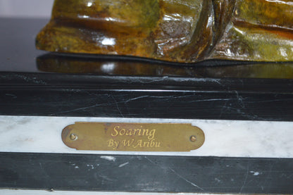 Eagle Soaring Bronze Statue by W Aribu -  Size: 35"L x 27"W x 38"H.