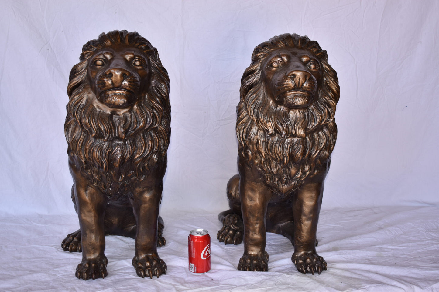 A Pair of Lions Sitting on The Ground Bronze Statues Size: 14" x 27" x 29"H