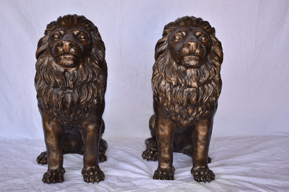 A Pair of Lions Sitting on The Ground Bronze Statues Size: 14" x 27" x 29"H