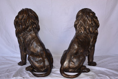 A Pair of Lions Sitting on The Ground Bronze Statues Size: 14" x 27" x 29"H