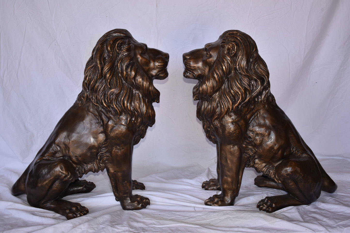 A Pair of Lions Sitting on The Ground Bronze Statues Size: 14" x 27" x 29"H