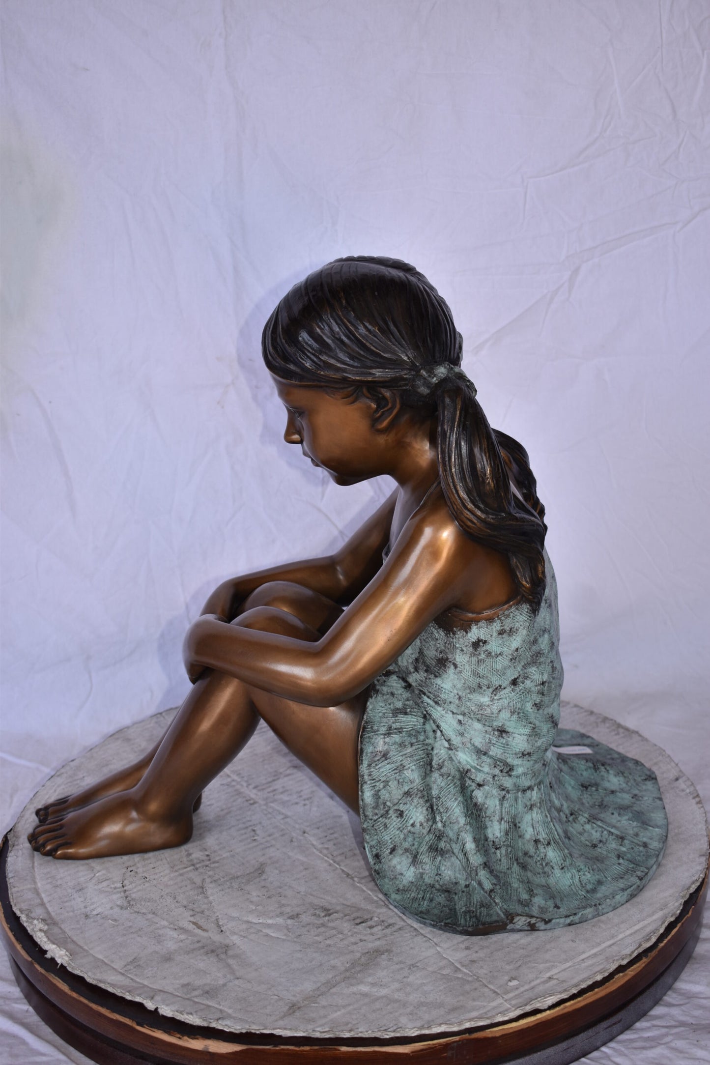 Girl Sitting on The Ground Enjoying the Sun Bronze Statues  22" x 15" x 19"H