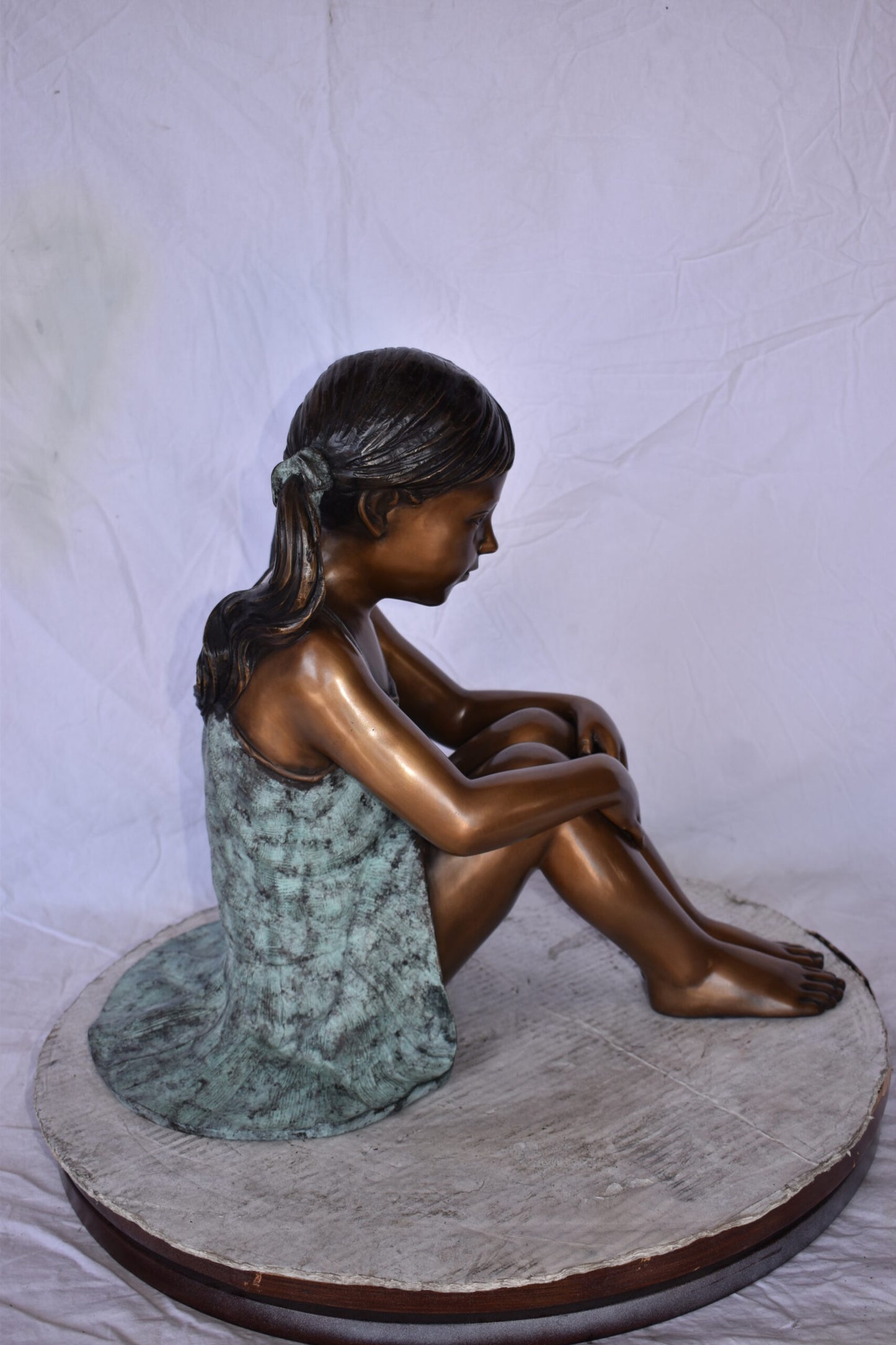Girl Sitting on The Ground Enjoying the Sun Bronze Statues  22" x 15" x 19"H