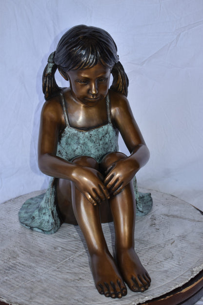 Girl Sitting on The Ground Enjoying the Sun Bronze Statues  22" x 15" x 19"H