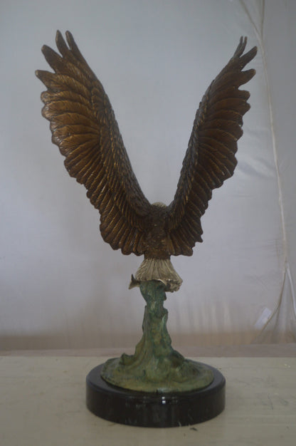 Eagle Catching His Prey from Water Bronze Statue -  Size: 14"L x 13"W x 26"H.