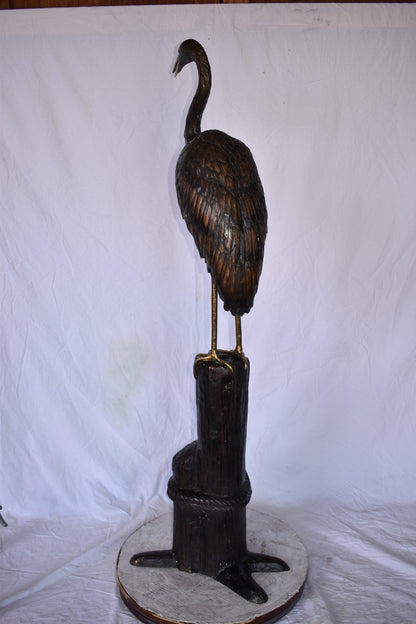 Crane Looking Out Standing on A Tree Stump Bronze Statue Size: 19" x 17" x 62"H