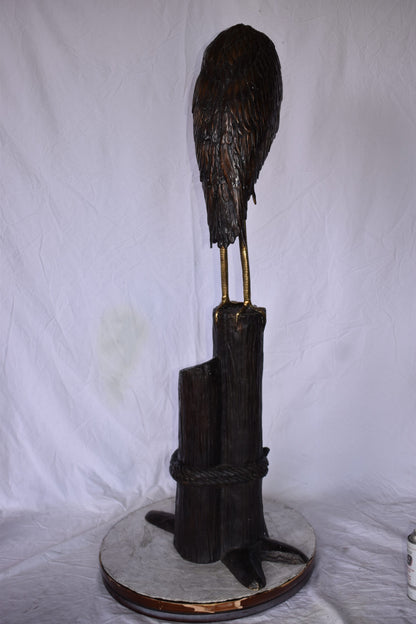 Crane Head Down Standing on A Tree Stump Bronze Statue Size: 23" x 16" x 55"H