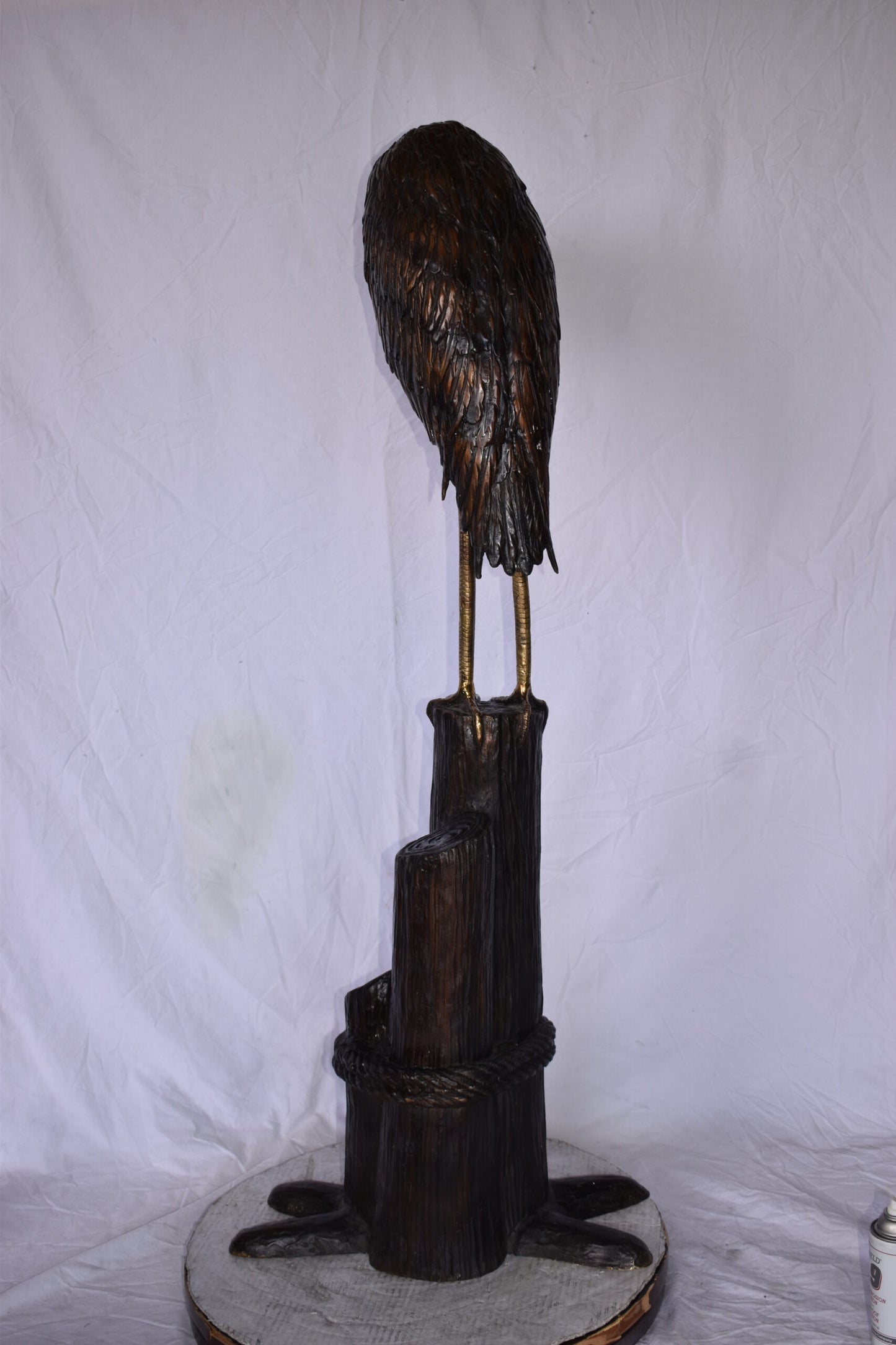 Crane Head Down Standing on A Tree Stump Bronze Statue Size: 23" x 16" x 55"H