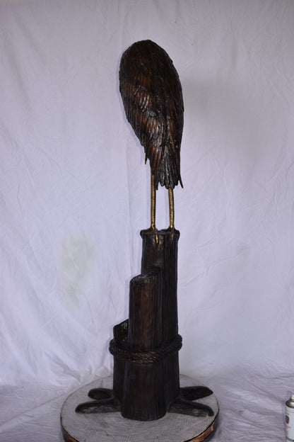 Crane Head Down Standing on A Tree Stump Bronze Statue Size: 23" x 16" x 55"H