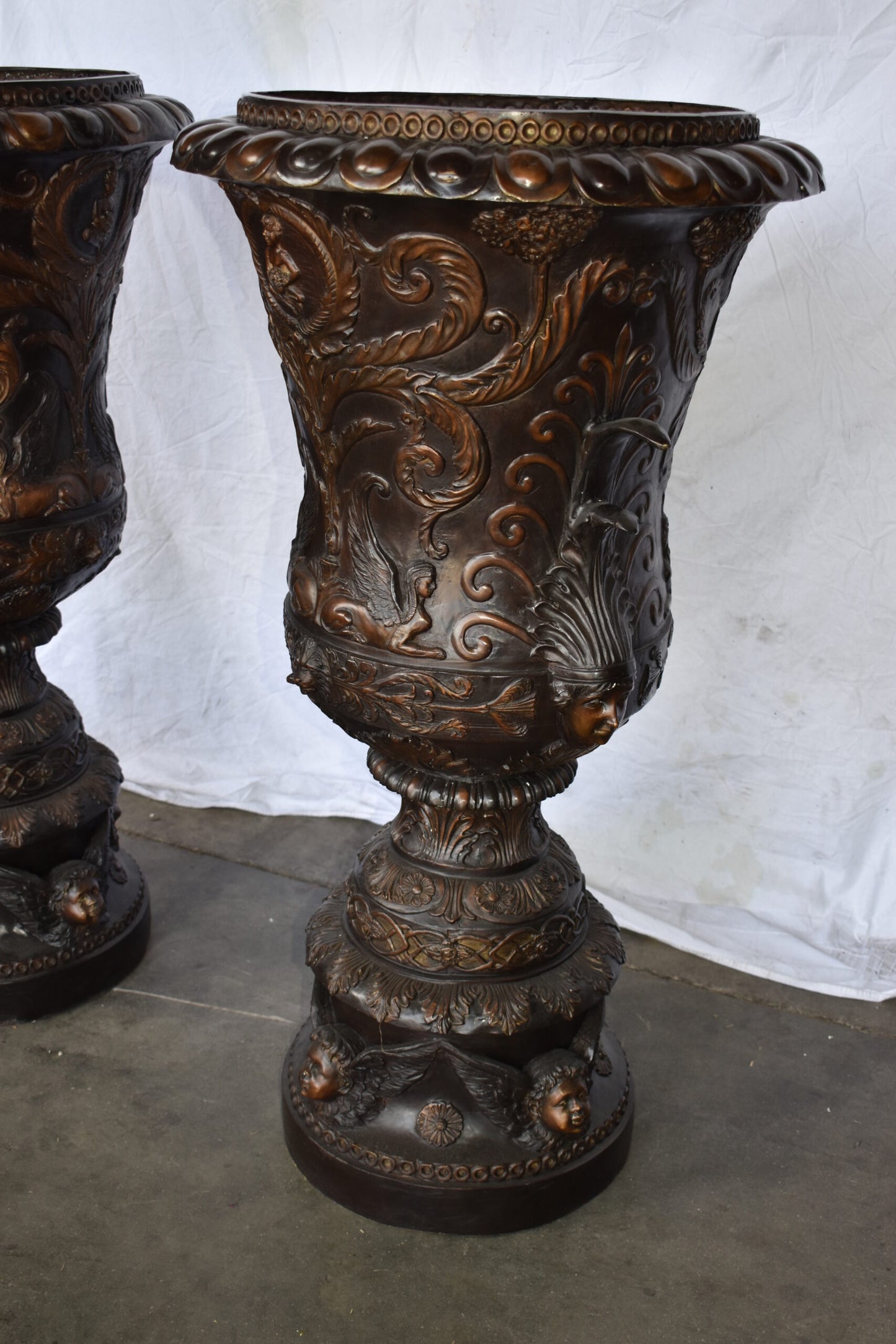 A Large Pair of Urns with Lady Faces Bronze Statue Size: 23" x 23" x 43"H