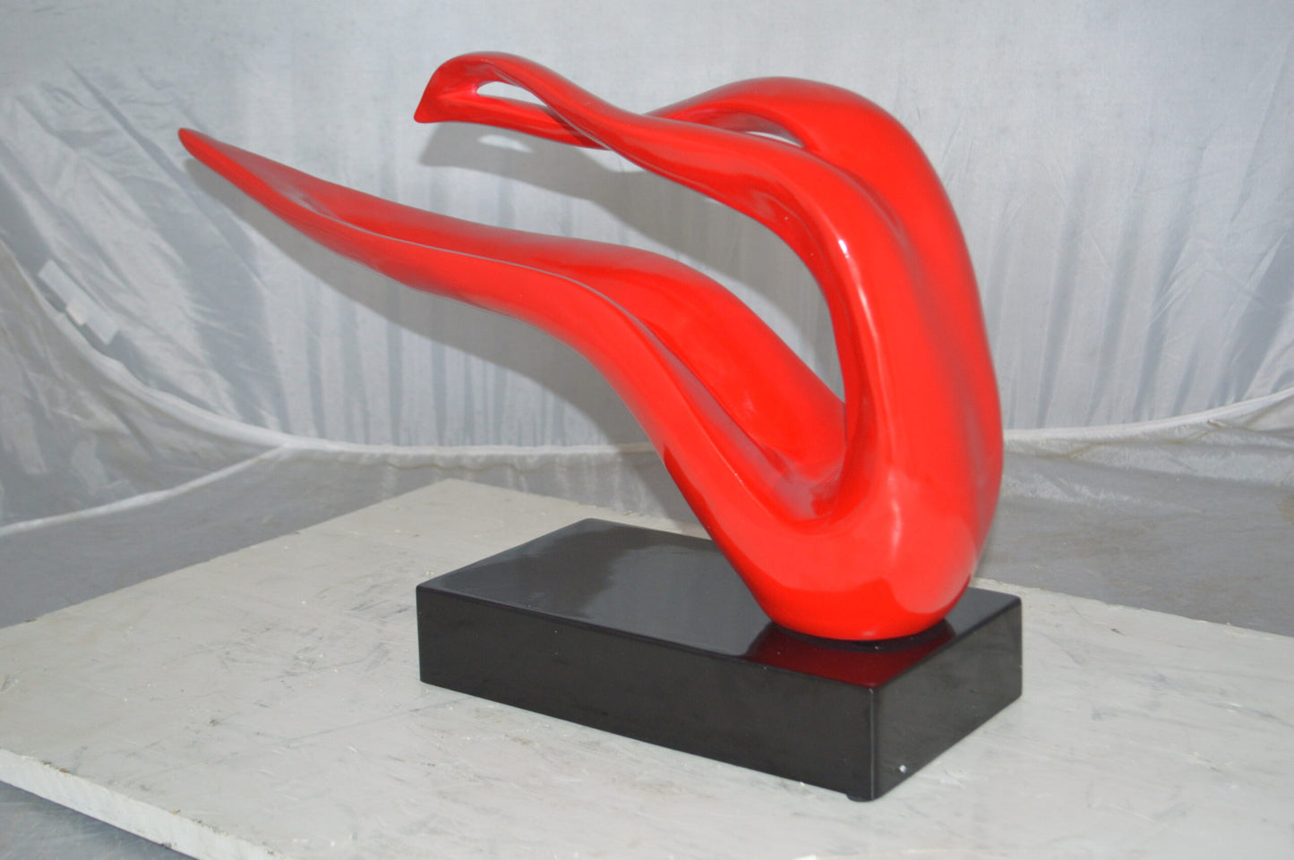 Modern Art Red Ribbon Resin Statue -  Size: 25"L x 6"W x 13"H.