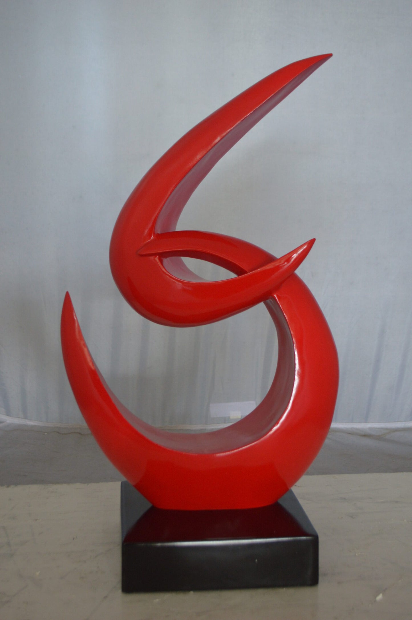 Modern Art Red Boomerang Statue made of Resin -  Size: 13"L x 8"W x 23"H.