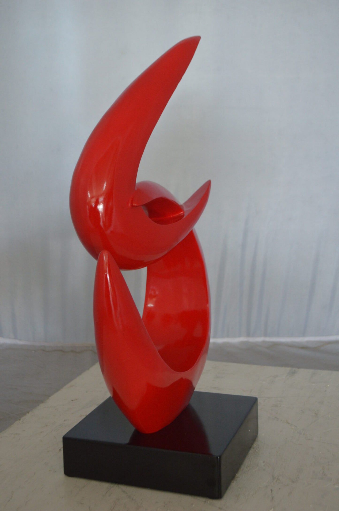 Modern Art Red Boomerang Statue made of Resin -  Size: 13"L x 8"W x 23"H.