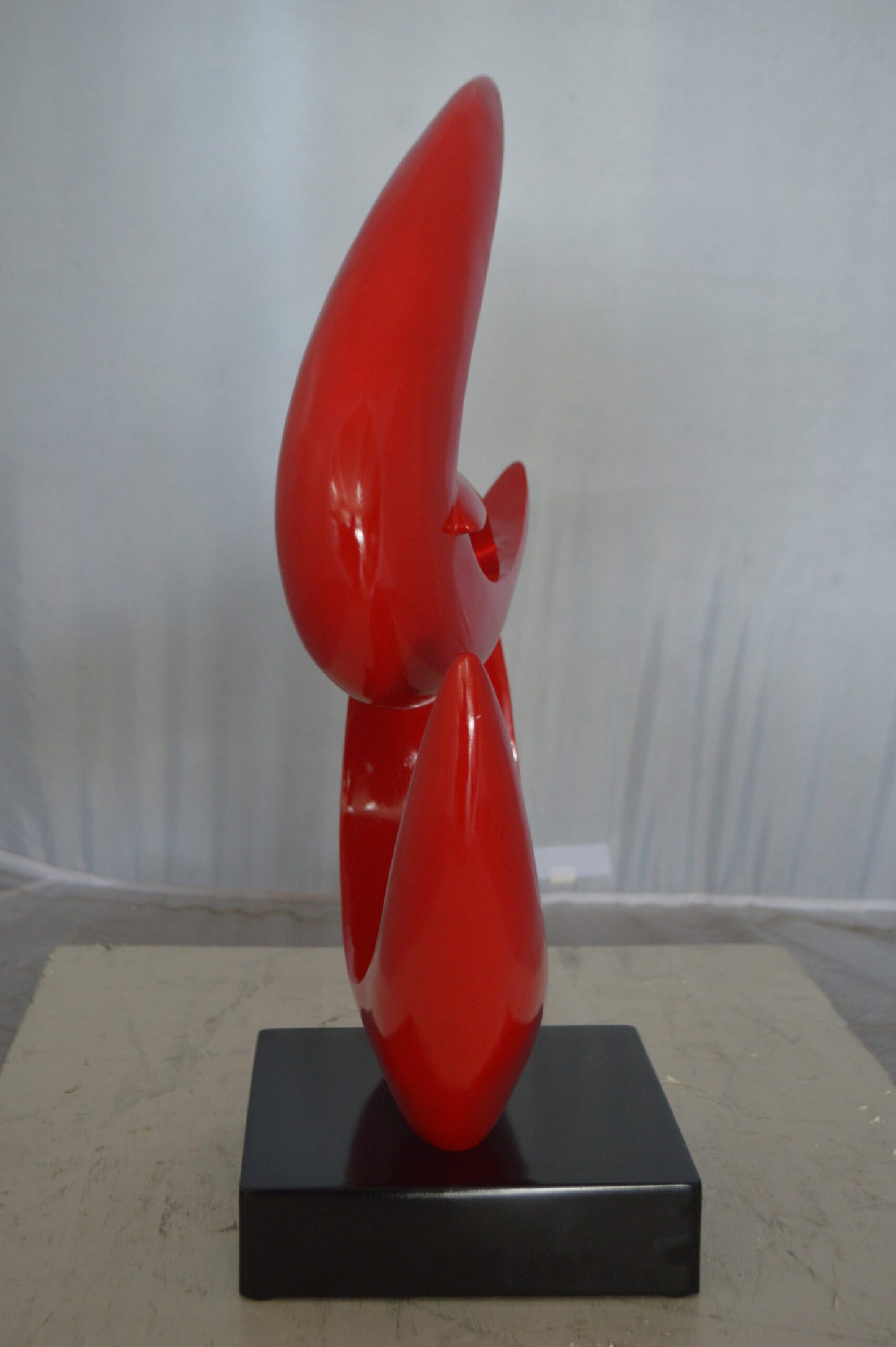 Modern Art Red Boomerang Statue made of Resin -  Size: 13"L x 8"W x 23"H.